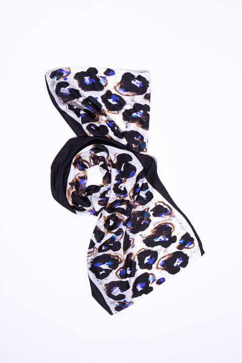 Black and white printed floral silk long scarf with electric blue touches. Abstract twill scarf by Dikla Levsky