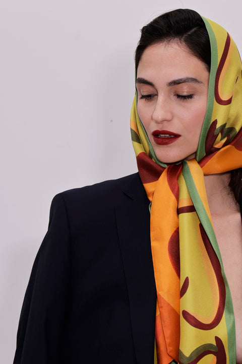 Printed silk scarf in vibrant colors and long shape with diagonal edges