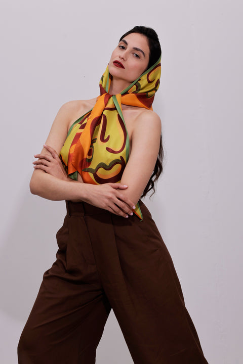 Printed silk scarf in vibrant colors and long shape with diagonal edges